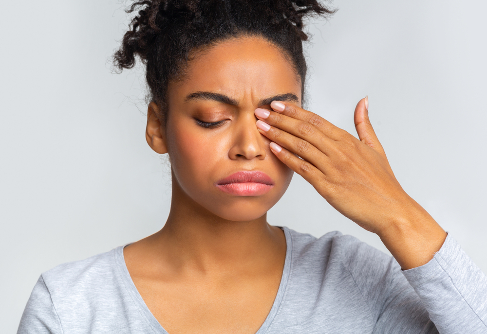 How to Prevent Styes 1 Woman touching her eye in pain due to a style in Chesapeake, VA