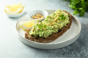Mashed avocado on toast with peanuts