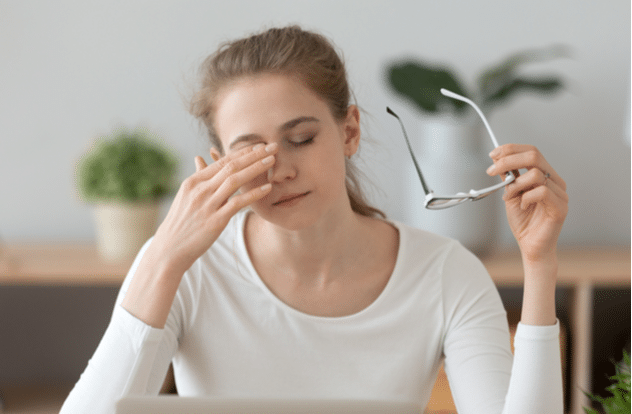 Fatigued teen girl taking off glasses take break to relieve dry irritable eyes