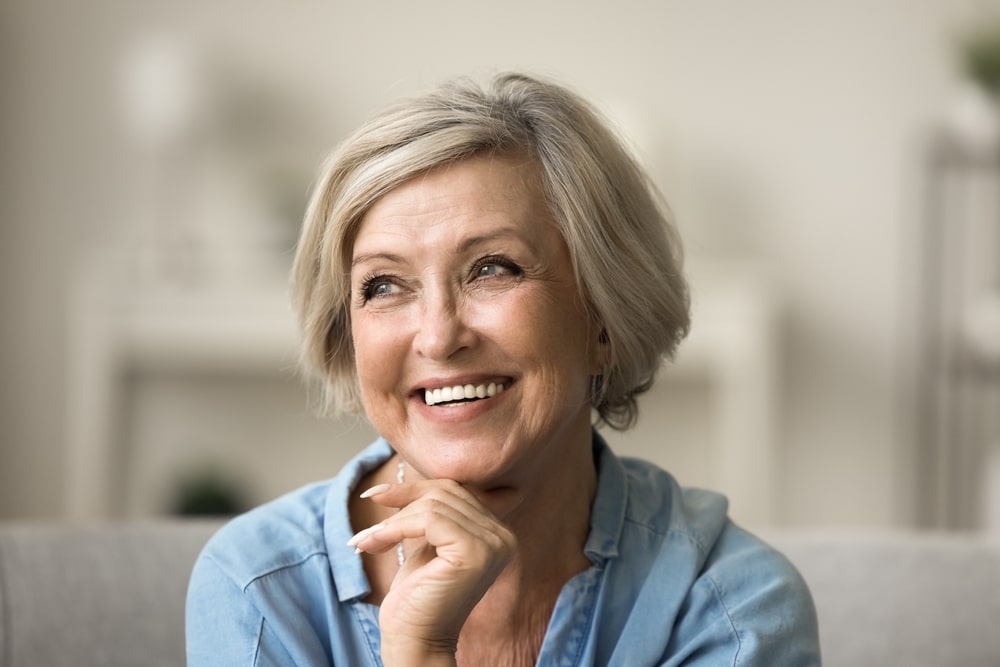 Older woman smiling who has age related macular degeneration in Chesapeake, VA