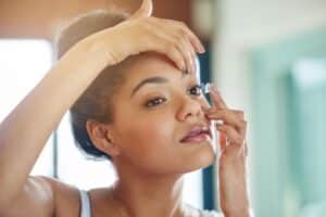 Teen girl putting in contact lens in Chesapeake, VA